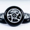 Universal Rollerski Wheels Set of three universal rollerski wheels, showcasing their sleek design, high-performance construction, and compatibility with brands like FF, IDT, Swenor, Swix, and Fischer.
