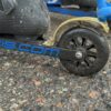 Rollerski with integrated brake fender Rollerski with integrated brake fender activated by ski pole.
