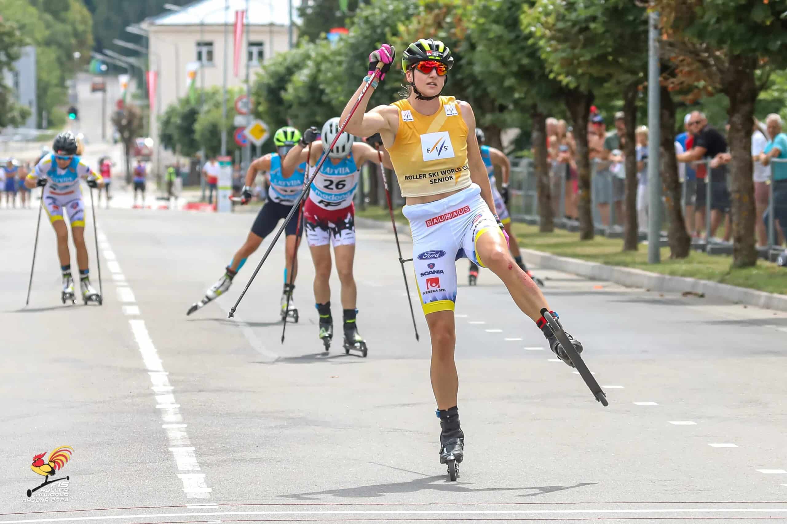 Linn Sömskar wins FIS Roller Ski World Cup race in Madona 2024, skating across the finish line.