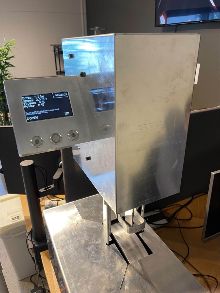A stainless steel rolling resistance machine with a digital interface measuring force and torque for FF Rollerskis.