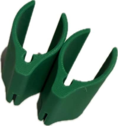FF PoleControll Green Clip Accessories Two green FF PoleControll clips for rollerski poles featuring a textured grip and ergonomic design.