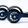 FF Rollerskis Suspension Technology Detail Close-up of FF Rollerskis showing integrated suspension forks and durable wheels for smooth asphalt training.