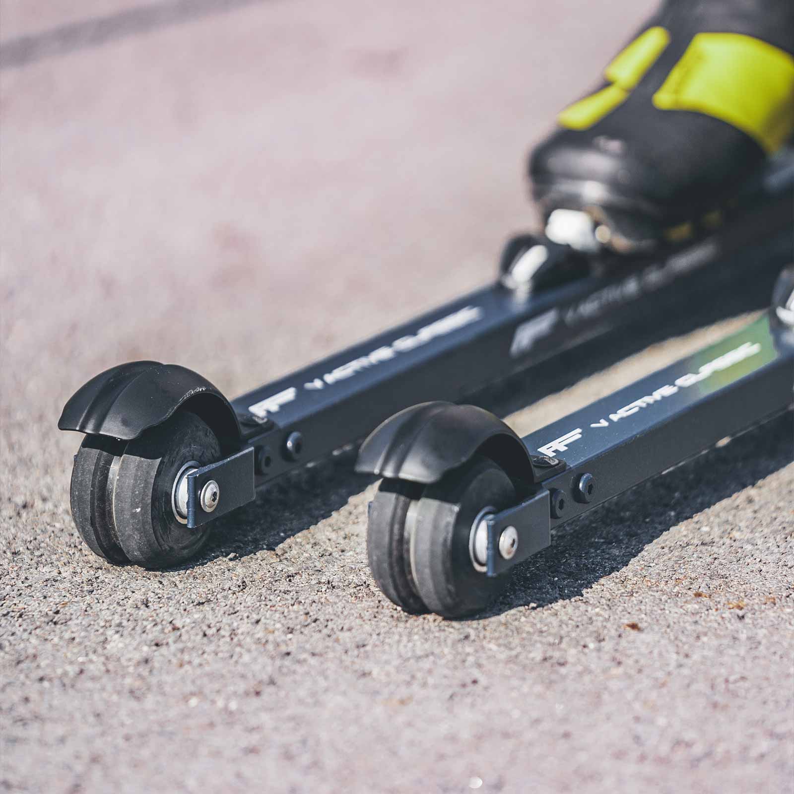 Front view of a skier using FF V Active Classic roller skis, highlighting control and performance