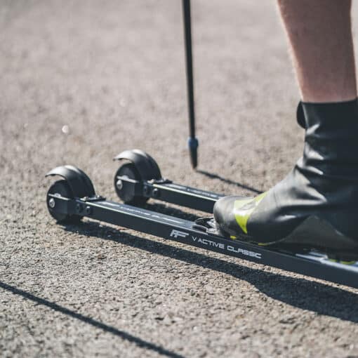 FF-V-Active-Classic-Rollerskis-in-Action-on-Track A skier using FF V Active Classic roller skis on a track, demonstrating stability and performance